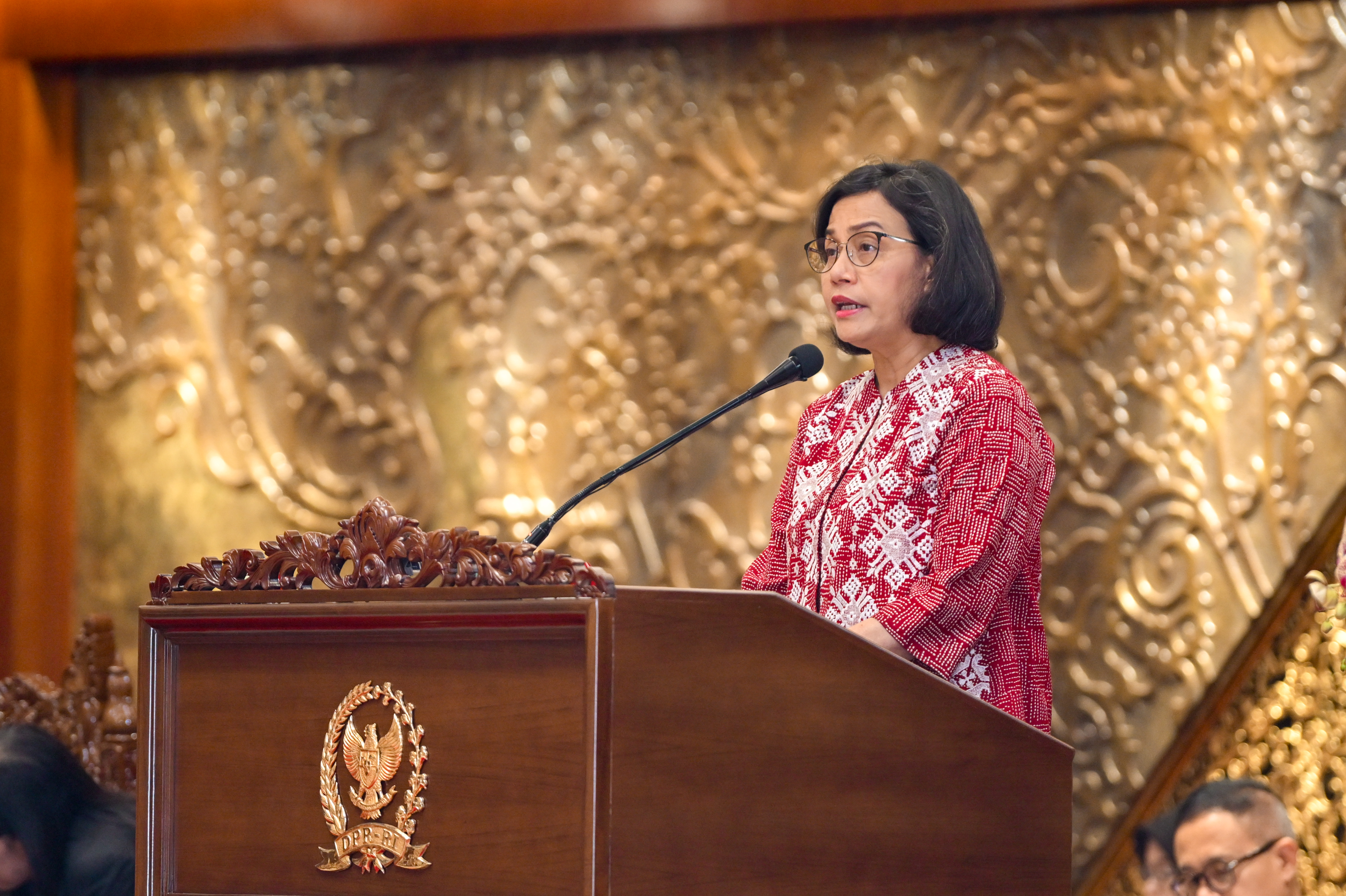 a woman standing at a podium
